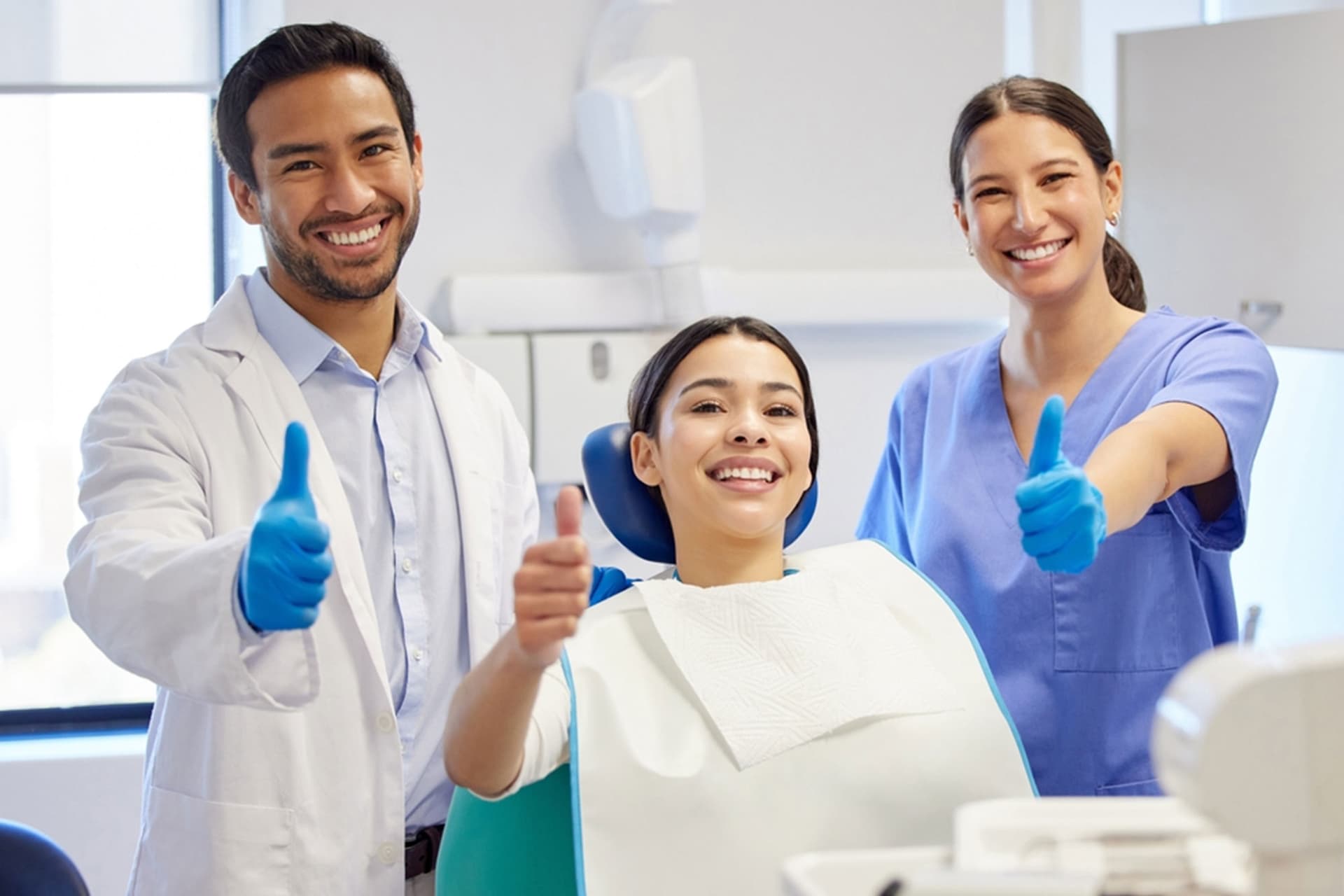 Dental team with patient smiling in the clinic