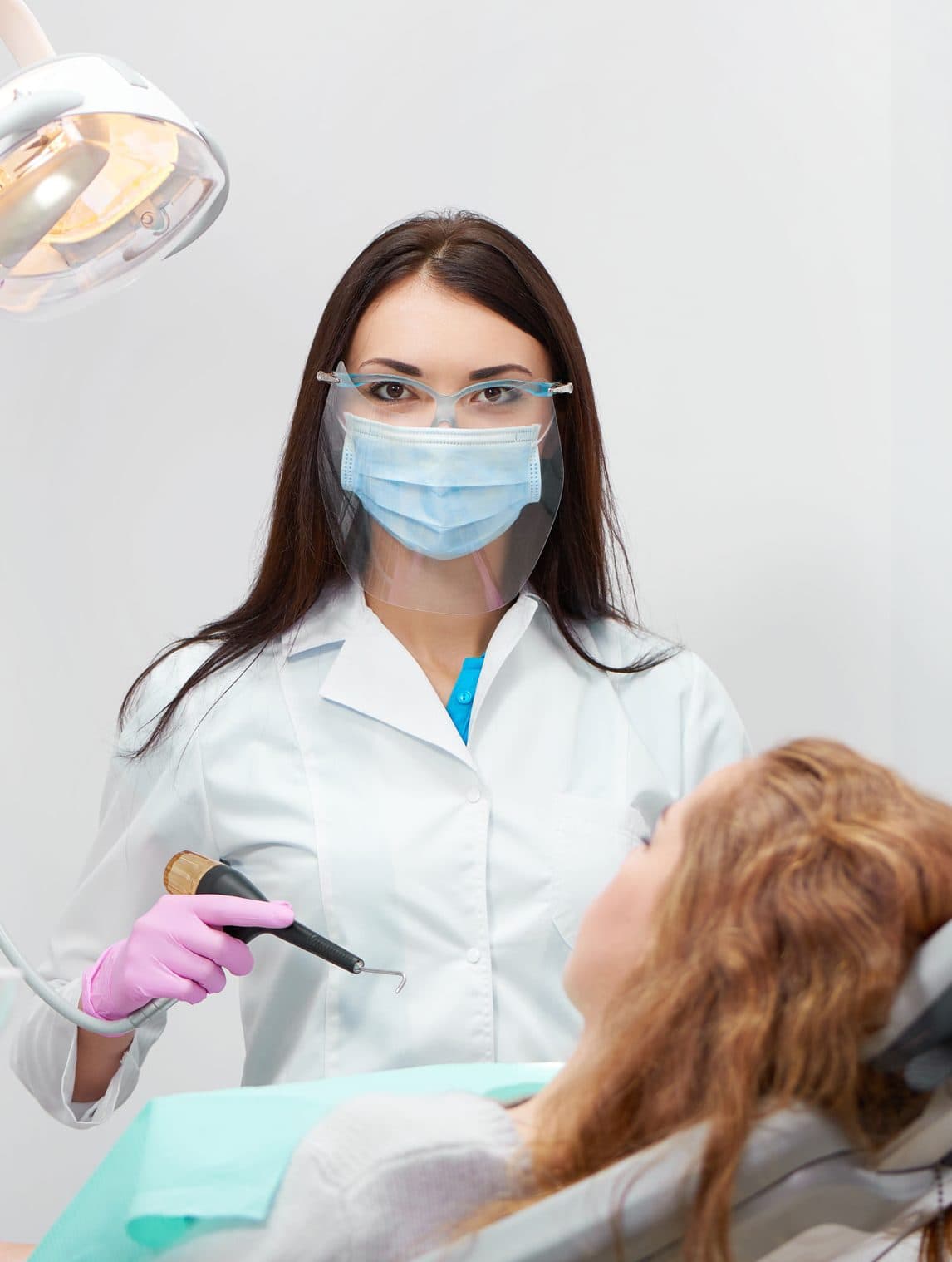 Dentist examining a patient in Milpitas